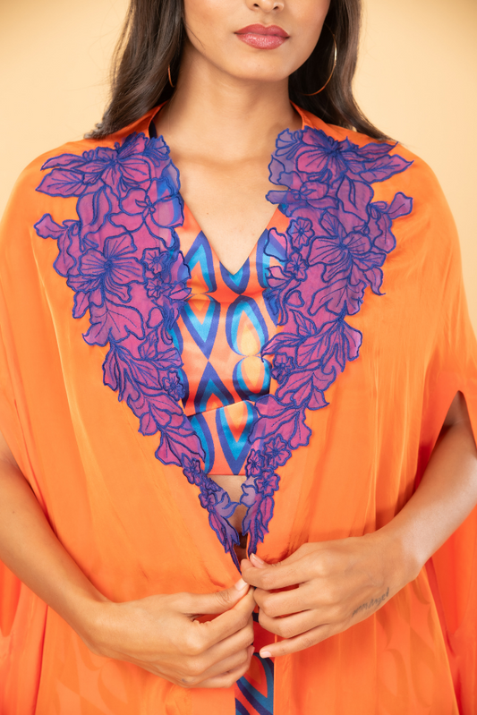 Orange and blue drop print crop top and skirt with cutwork cape