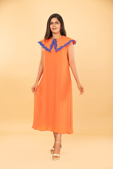 Orange tunic with pleated embroidered collar