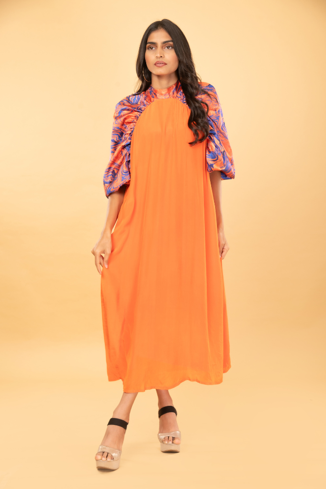 Orange tunic with marble print sleeves